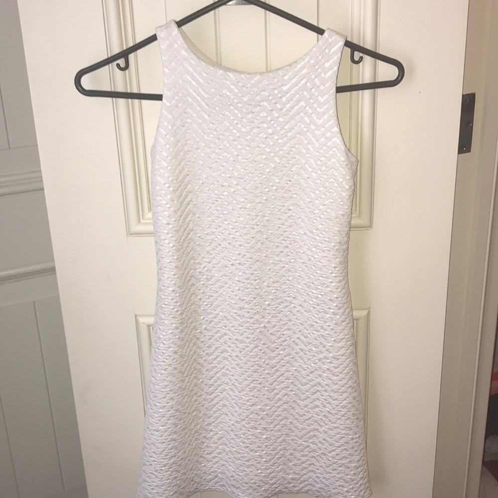 white dress with slight zig zag pattern